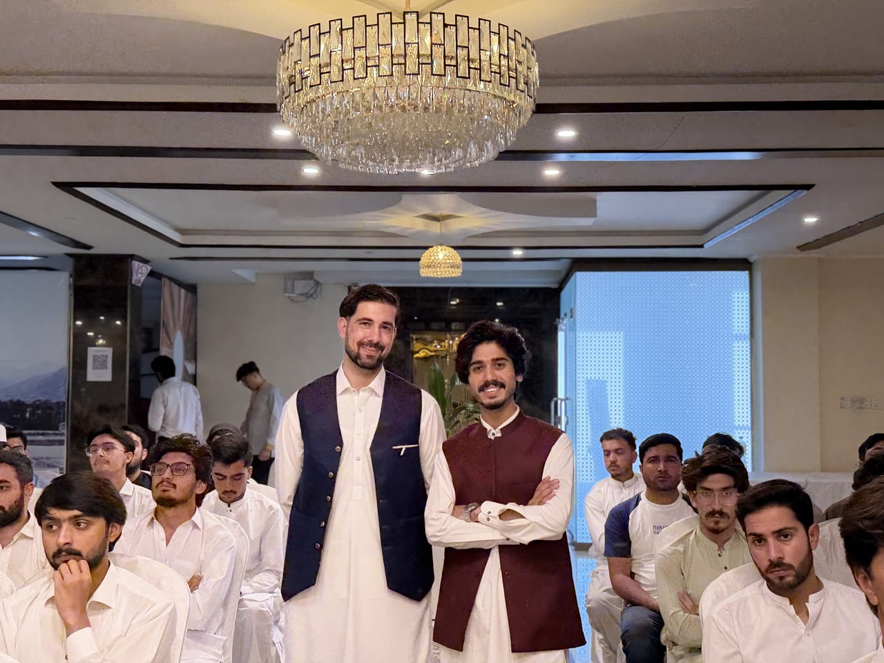 Digital KP Network organizers standing among attendees at Swat Palace